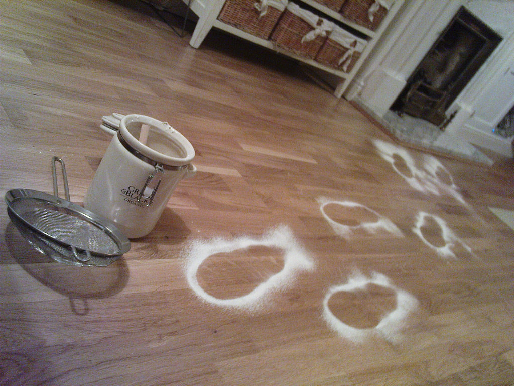 \"Santa footprints\" made with flour on hardwood floor.