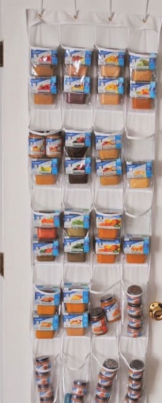 Shoe organizer used to store baby food packages.