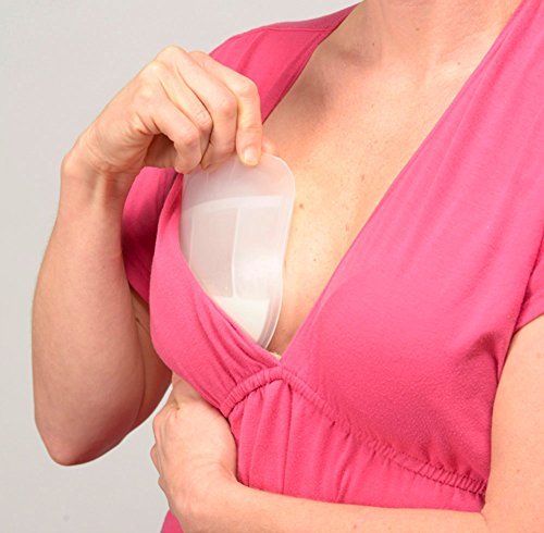 Woman demonstrates milk saver product for nursing moms.