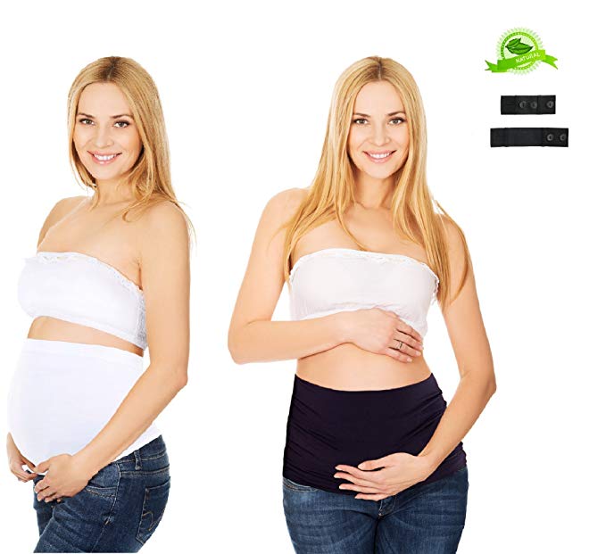 Woman models belly band for maternity wear.