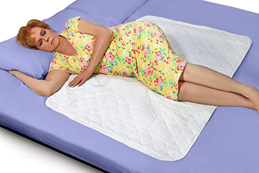 Woman models postpartum bed pads.