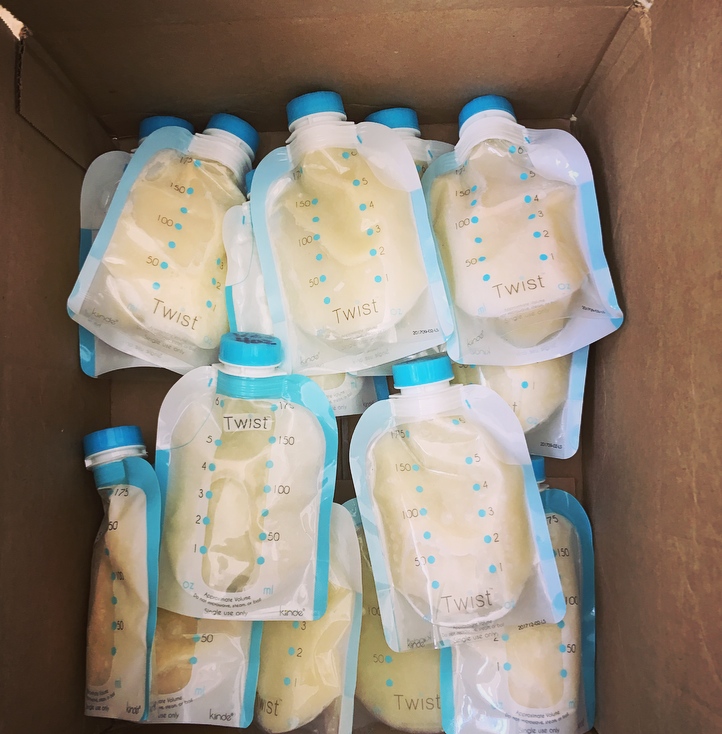 Packages of pumped breast milk in box.