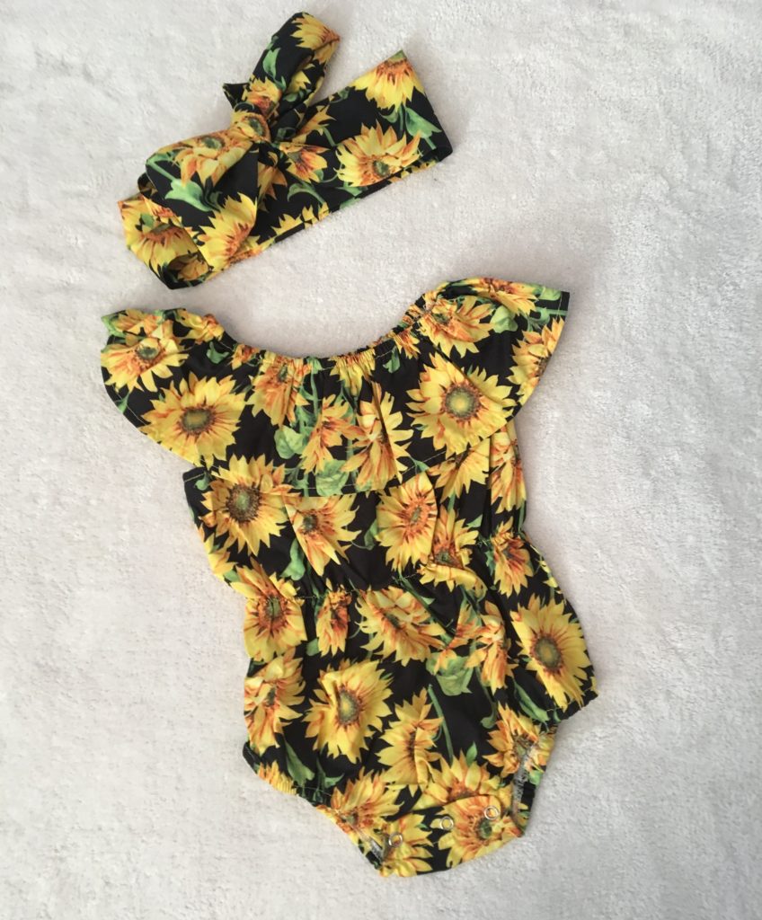 Sunflower romper and bow for baby girl.