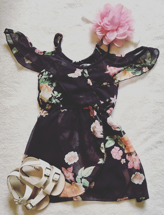 Black flower print dress for little girl.