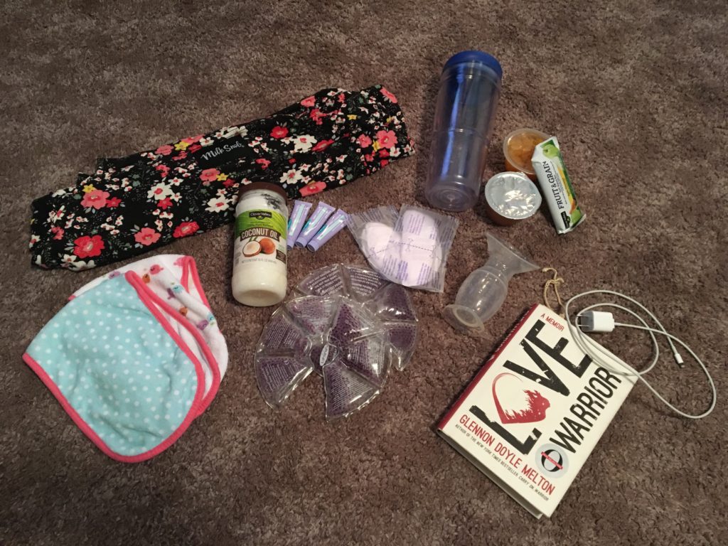 Items to help new mothers including a water bottle, phone charger, coconut oil, etc.