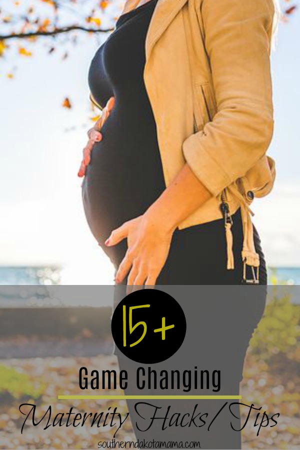 Pinterest graphic with text for Game Changing Maternity Hacks and Tips and woman holding pregnant belly next to fall foliage.