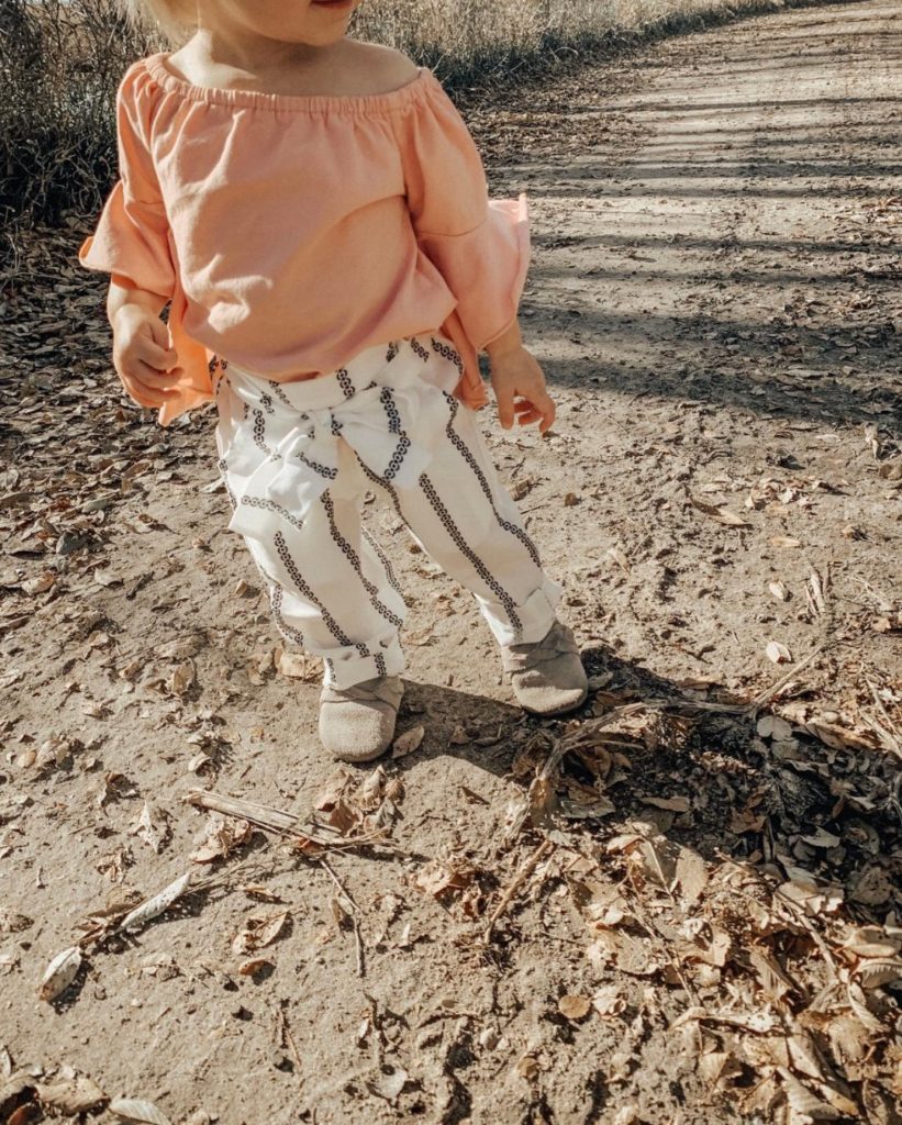 Toddler girl in outfit for Thanksgiving.