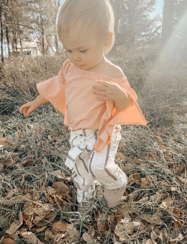 Toddler girl in Thanksgiving outfit.