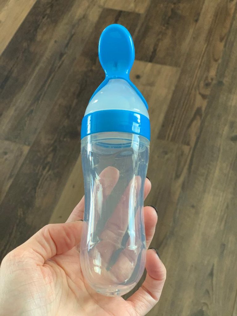 Silicone squeeze spoon for feeding babies.